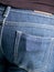 Abstract mobile phone in the back pocket of jeans - placeholder