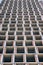 Abstract modern architecture fragment with concrete floors and walls with red bricks under construction. Bottom view