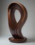 Abstract modern cocobolo wooden sculpture with mainly round shapes, standalone