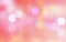 Abstract multicolor blurred bokeh light on light pink