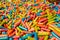 Abstract multicolored background made of many colorful sweet sticks of chewing sweets in icing. A tasty and healthy delicacy made