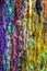 Abstract multicolored background of streaks of wax candles. Stripes of different colors. Close-up.