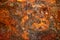 Abstract natural texture with many stalactites growing from the ceiling in Damlatas cave Alanya, Turkey. Yellow-orange-brown