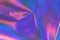 Abstract neon holographic metallic foil background in 80s, 90s style