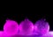 Abstract neon purple and pink gradient glitter glass Christmas baubles background with copy space.