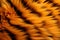 Abstract orange and black tiger stripes artificial fluffy background