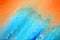 Abstract orange-blue motion blur with crystallize effect, use as the background of an element.