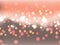 Abstract orange bokeh. Blurry bright abstract bokeh on a gray-orange background.