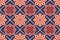 Abstract orange geometric patterns on a navy background. Thai textiles style ornaments