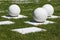 Abstract outdoor composition of white balls on bases