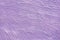 Abstract painted decorative background. Wall painted in lilac texture