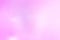 An abstract pale pink background  with purple waves, interference, moire