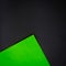 Abstract paper background, black and green sheet of paper