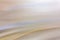 Abstract pastel festive background. Light blur. Oblique lines and waves in beige-blue shades. Horizontal digital banner