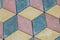 Abstract paving tiles in the form of cubes of tiles of different colors