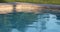 Abstract Peaceful Swimming Pool Water and Deck in Sun