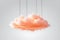 Abstract peach color curly cloud suspended by strings, isolated on white background. Textured 3D illustration