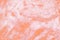 Abstract Peach Fuzz background with texture of slime or other liquid substance