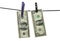 Abstract photo with american dollars with clothespins on clothesline on white background