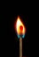 Abstract photo of burning matchstick on black