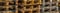 Abstract pick-up of stacked wooden pallets. Long format, panorama for website headline