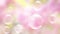 Abstract pink background with flying soap bubbles.