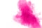 Abstract pink powder explosion on white background. Freeze motion of pink dust splattered