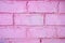 Abstract pink rough grunge brick wall background.