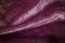Abstract pink violet magenta creasy velvet fabric background texture. beautiful luxurious fabric for draperies, curtains.