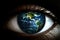 Abstract planet earth reflected in a closeup up eye. Earth Day concept. Global care in line of vision. Environmentalism.