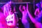 Abstract purple people dancing nightclub