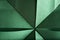 Abstract radial green background of textured paper folded using origami