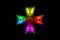 Abstract rainbow smoke cross isolated on black background