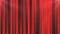 Abstract red curtain background in a theater or stage illuminated by spotlight