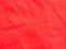 Abstract red texture blur background of synthetic fabric fiber