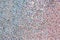 Abstract rhinestones background. Texture of rhinestones illuminated with multi-colored light. Pink and blue shine