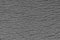 Abstract rough gray surface background. Similar to asphalt, concrete, plastic. Gray matte texture of the cells.