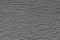 Abstract rough gray surface background. Similar to asphalt, concrete, plastic. Gray matte texture of the cells.