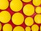 Abstract scene with yellow round disk or plates over red background. Polka dot pattern. 3d render