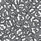Abstract seamless black and white pattern, made a brush on a gray background. Imitation of the skin of a leopard.