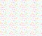 Abstract seamless ditsy pattern with pink, blue and yellow random spots and marks on white background.