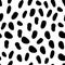 Abstract seamless pattern with black spots on white. Dalmatian skin imitation. Animal print. Vector illustration