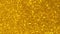 Abstract shiny glitter and sparkles 4k video background Golden or yellow glitter background with sparkling gems texture.