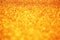 Abstract shiny sparkle orange glitter bokeh background