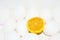 An abstract shot of a cut lemon amongst a bunch of eggs
