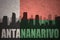 Abstract silhouette of the city with text Antananarivo at the vintage madagascar flag