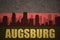 Abstract silhouette of the city with text Augsburg at the vintage german flag