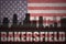 Abstract silhouette of the city with text Bakersfield at the vintage american flag