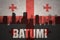 Abstract silhouette of the city with text Batumi at the vintage georgian flag