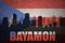 Abstract silhouette of the city with text Bayamon at the vintage puerto rican flag